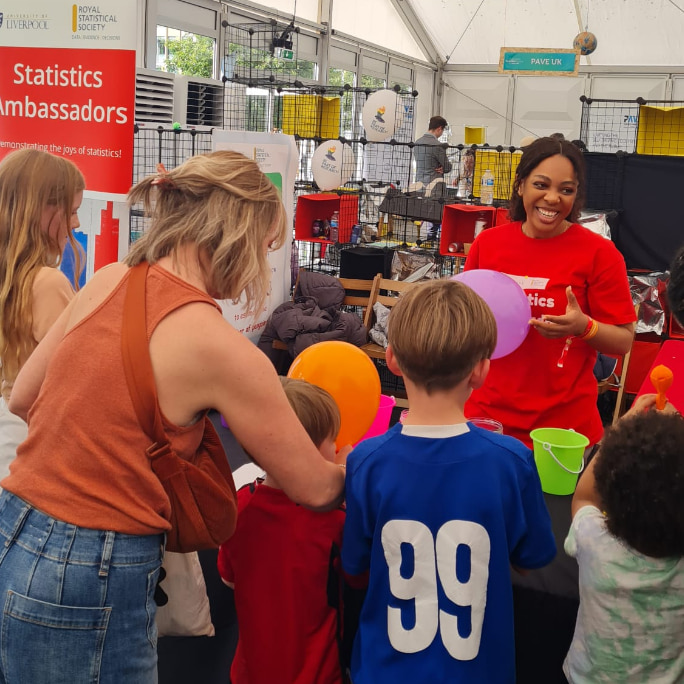 Children at the statistics stall at Cheltenham Science Festival