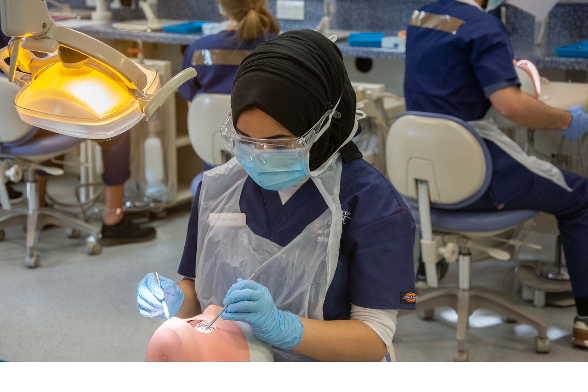 Dental student practising clinical skills