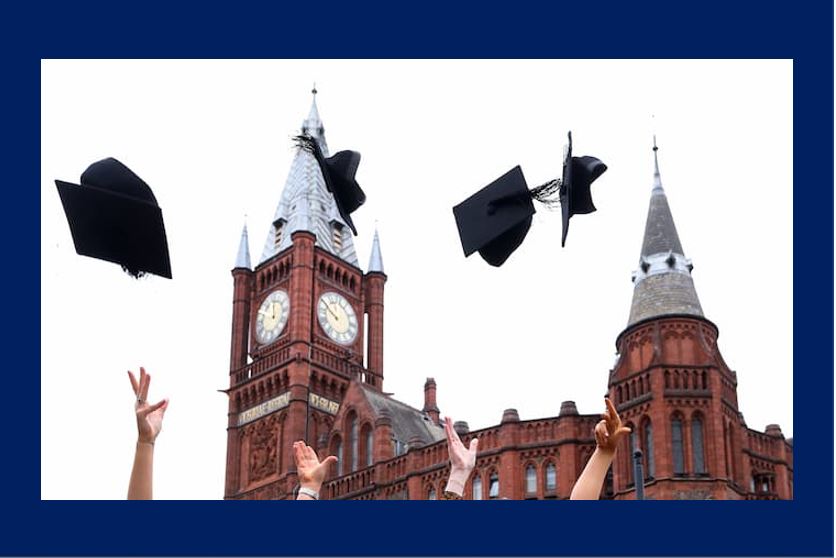 Graduates throwing hats in the air