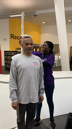 A volunteer being measured for his health check