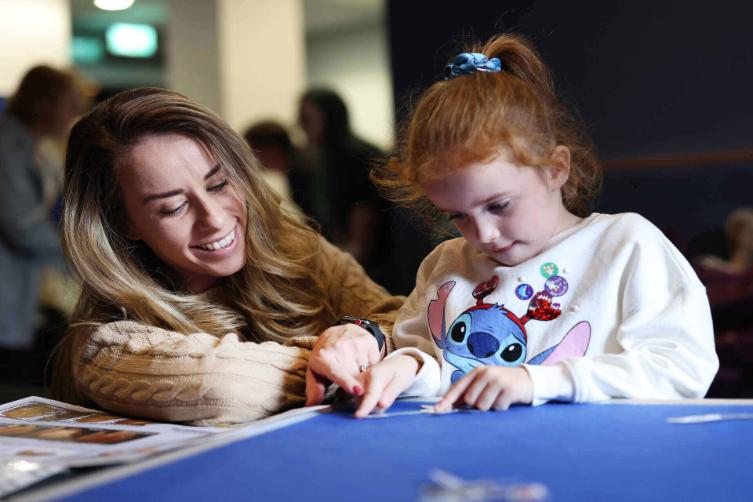 A woman and a child taking part in a Meet the Scientist activity