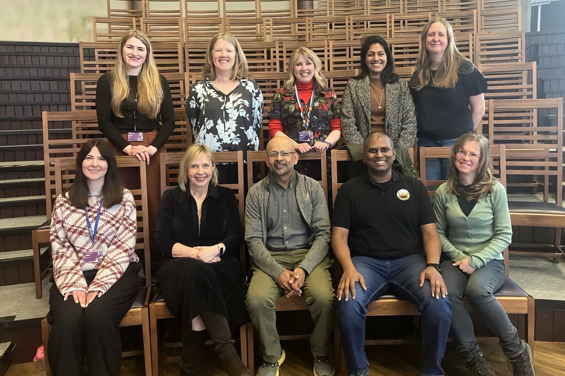 Dr Vasee Moorthy (bottom, centre) at the University of Liverpool with members of the COMET Initiative team.