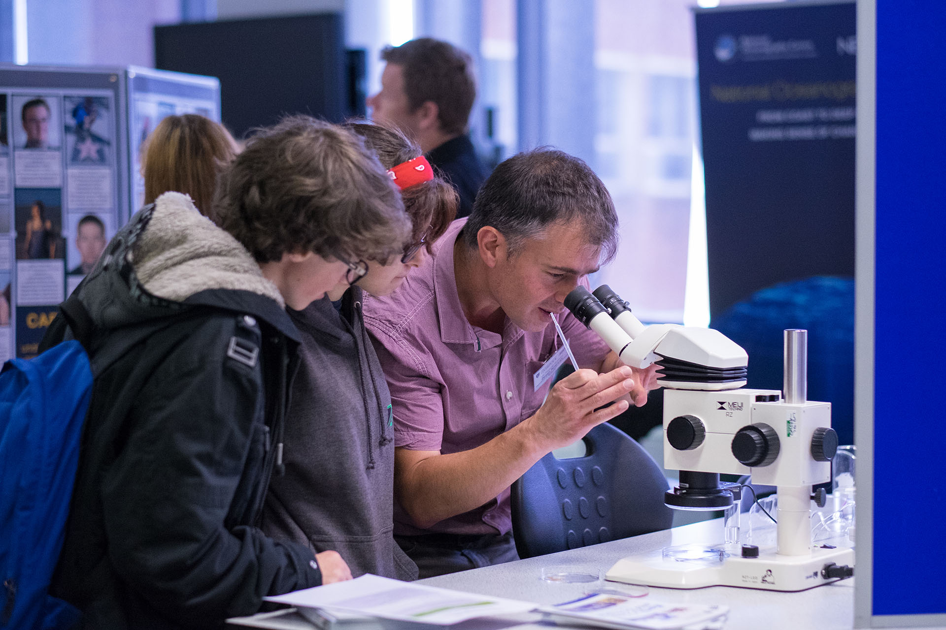 Students working with microscope