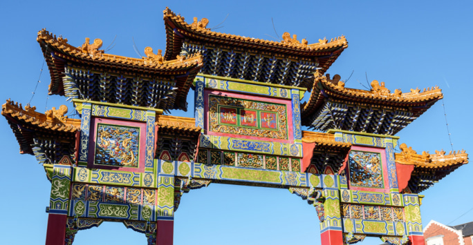 Liverpool's ornate, multi-coloured Chinese arch on a clear day.