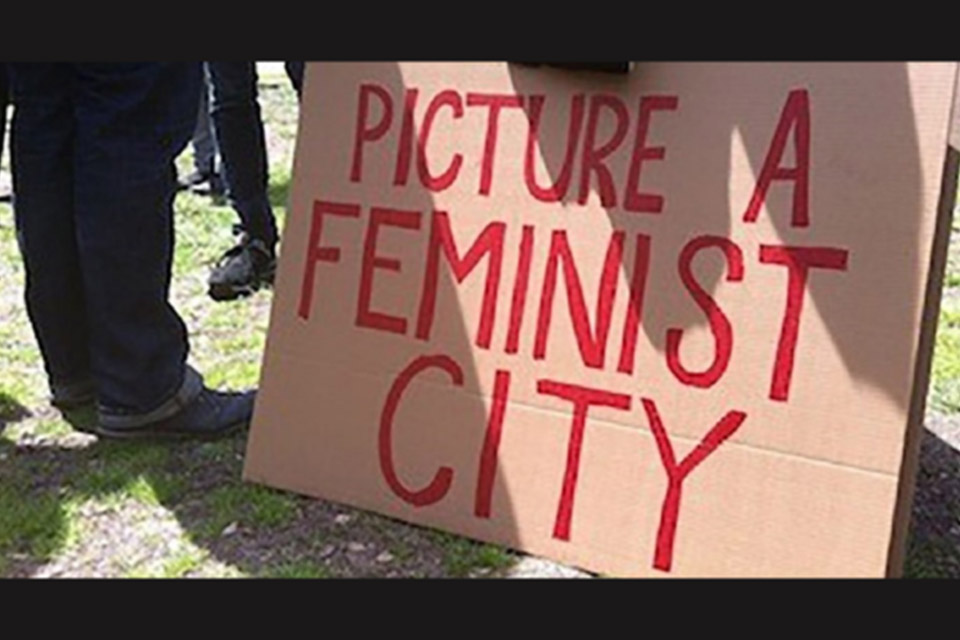 Placard saying picture a feminist city