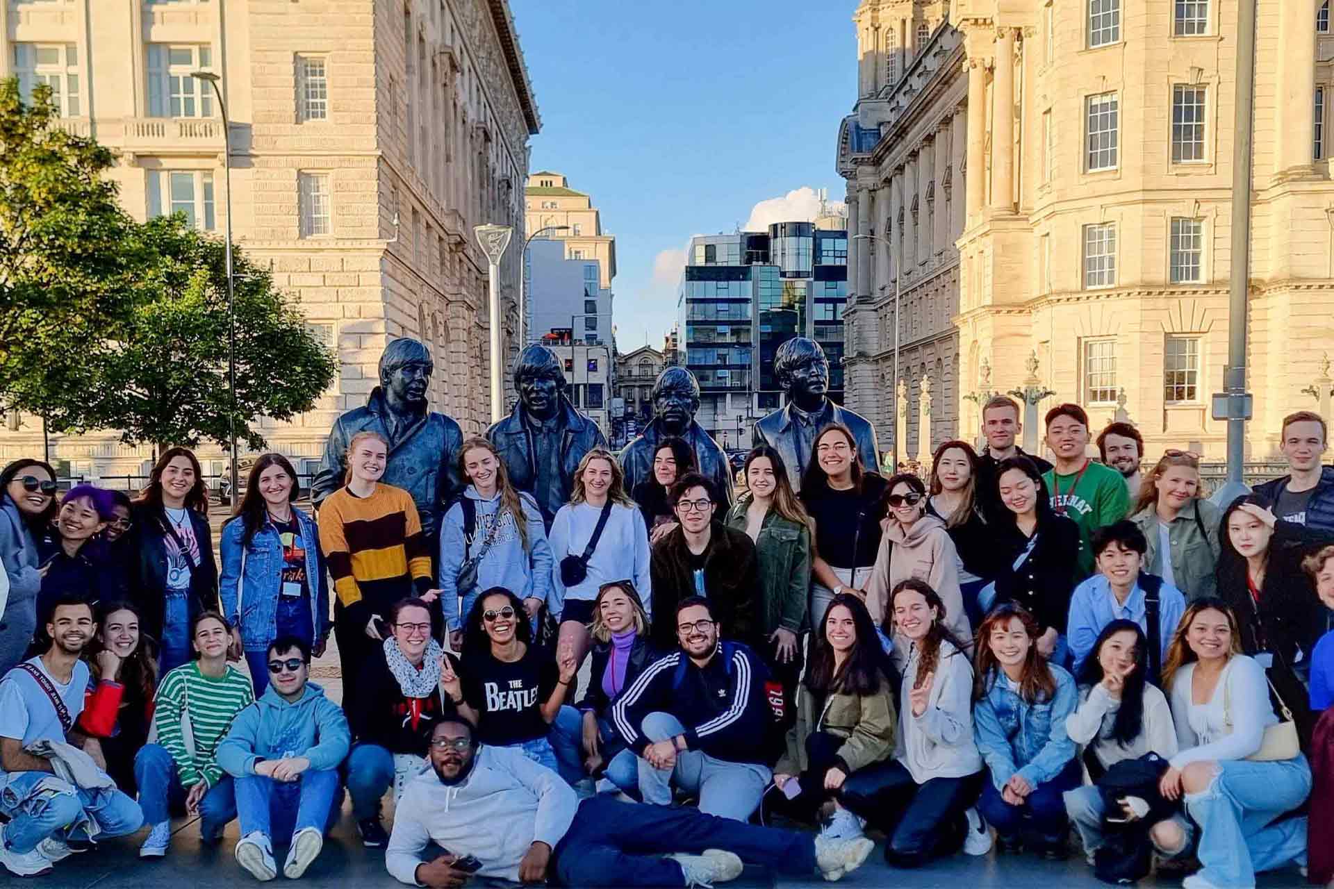 Global Opportunities students pose with The Beatles statue at Liverpool Pier Head