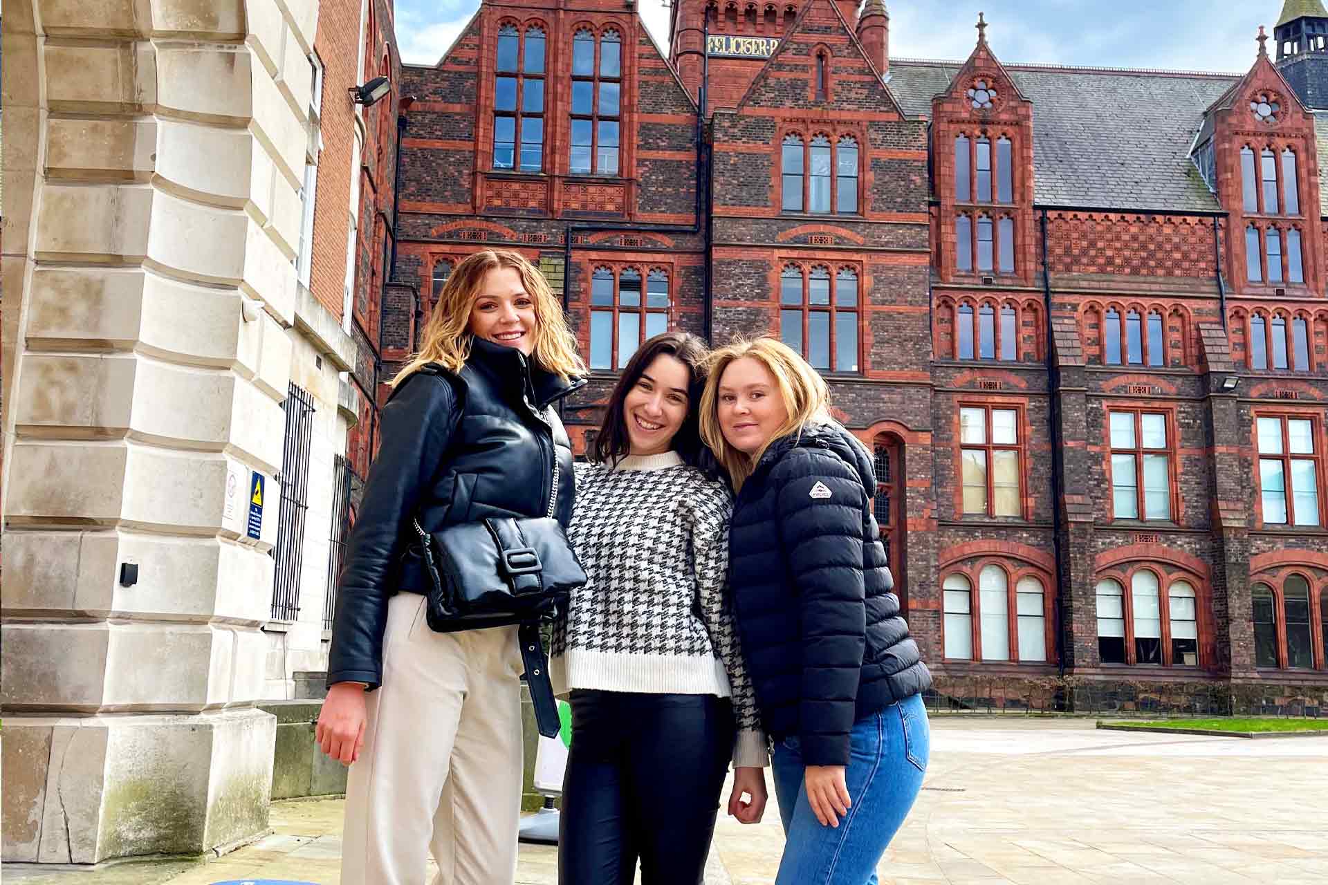 Three inbound students in The Quadrangle