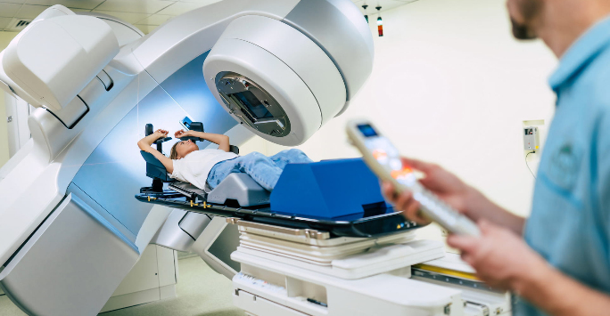 Woman receiving radiotherapy on a linear accelerator machine