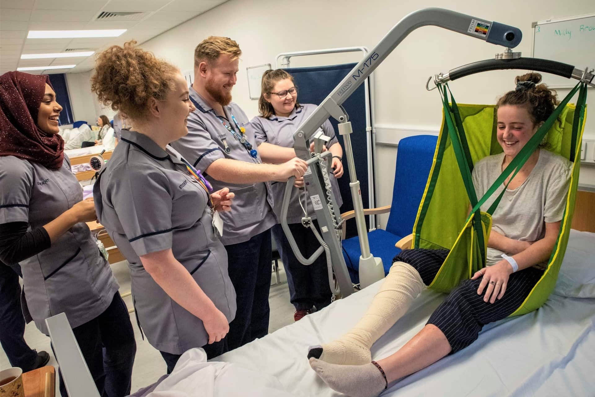 Student nurses operating a hoist