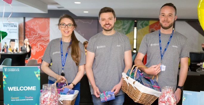 Students at a stall giving away merchandise