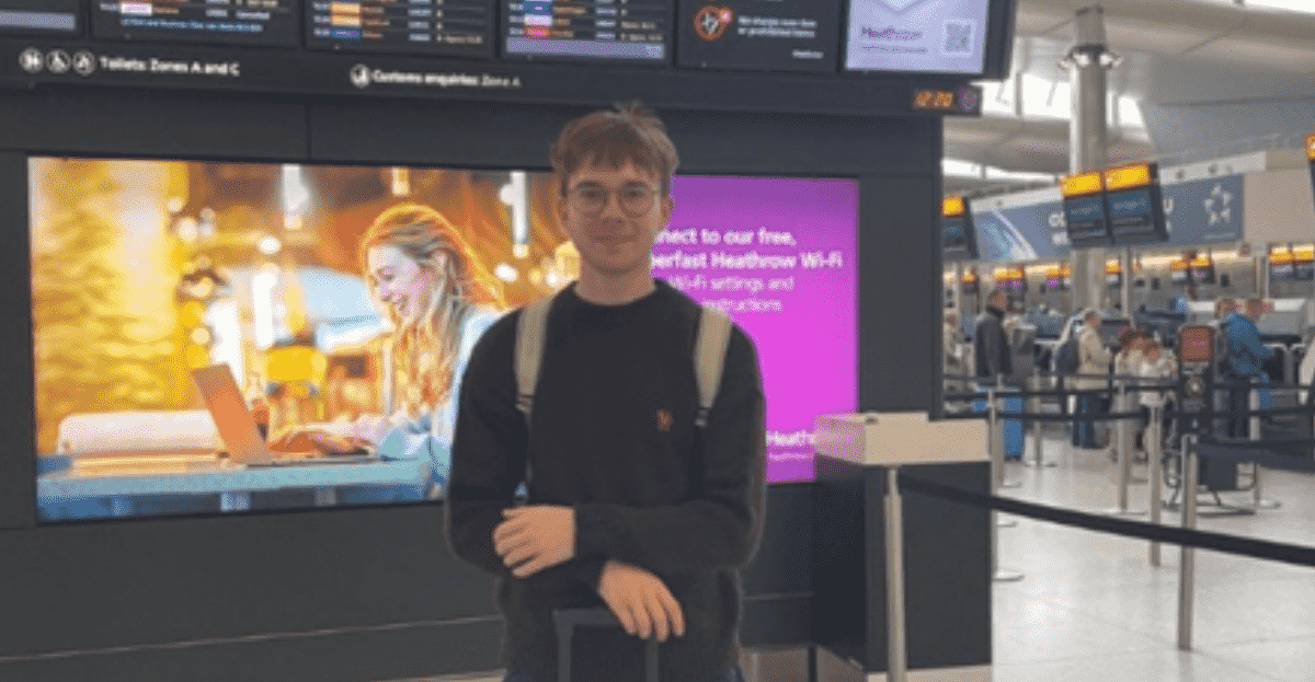 A picture of Politics with German student, Jakub outside the plane terminal