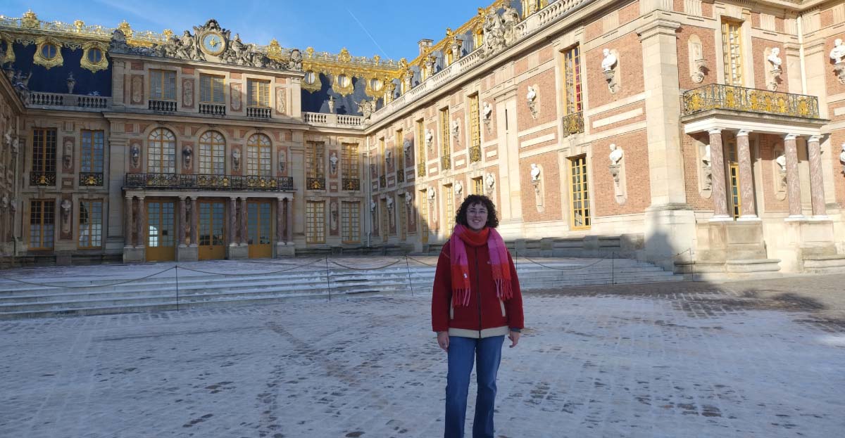 A student outside a palace