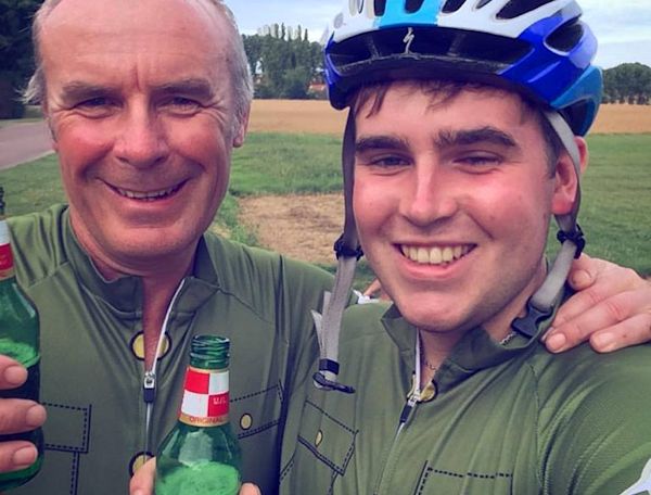 Two men wearing cycle helments.