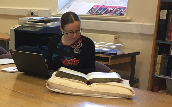 Archivists looking at records