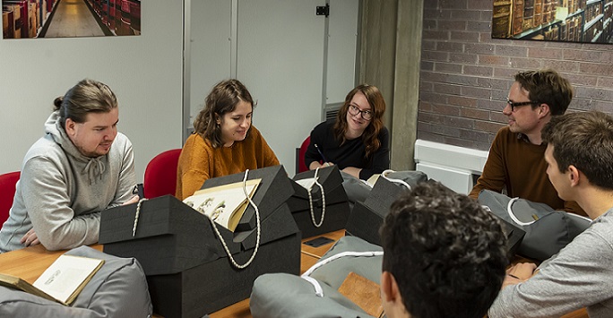 Students and lecturer in Special Collections and Archives