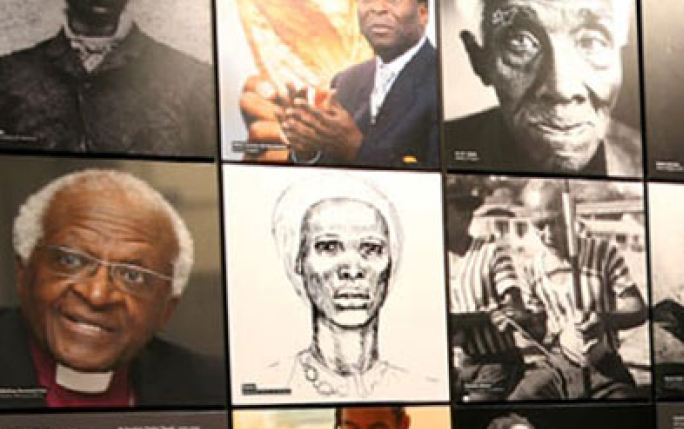 Wall of photographs of Black achievers at the International Slavery Museum