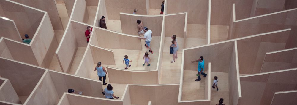 People walking through a maze