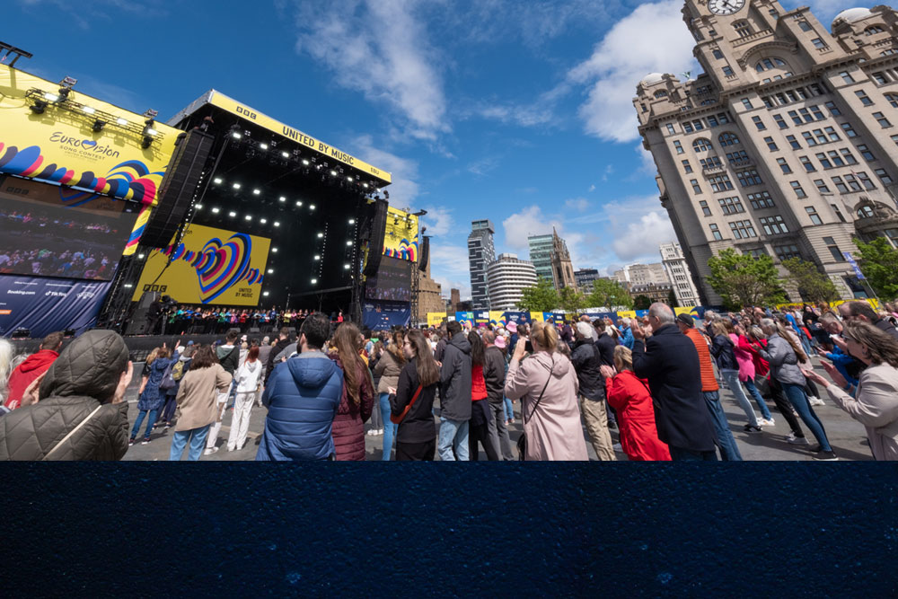 Crowds watching an outdoor Eurovision performance in Liverpool