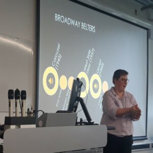 A photograph of Dr Freya Jarman presenting at Return to Learn Day 2024