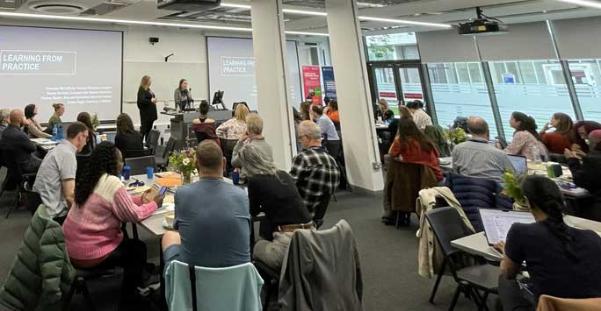 Ethics event participants sitting at tables