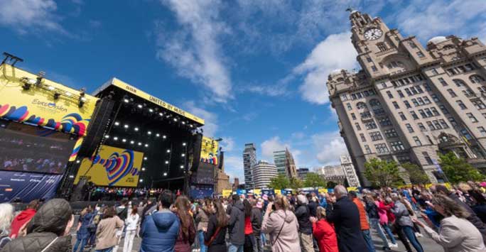 Crowds watching an outdoor Eurovision performance in Liverpool