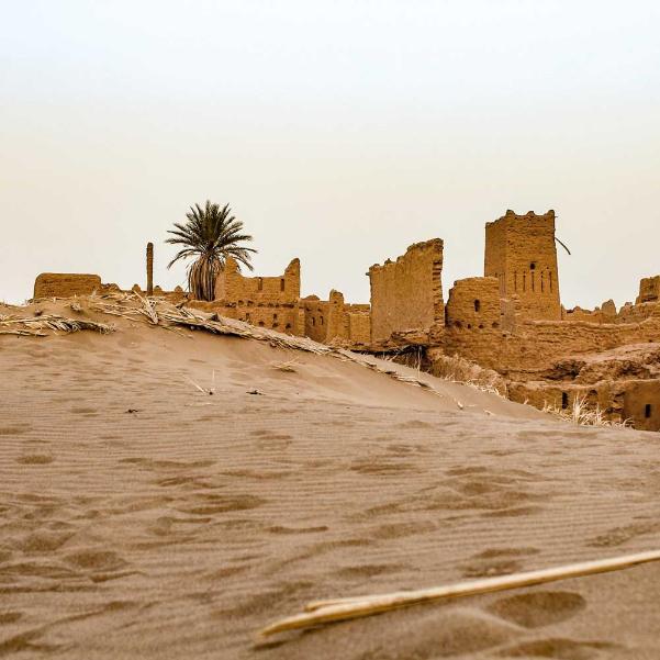 Sandstone buildings in a desert setting