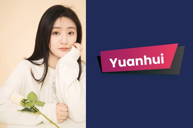 A student wearing a white sweater