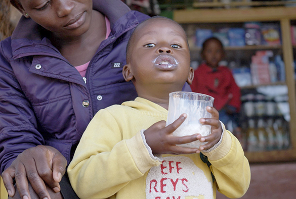 Boy drinking Milk in Kenya