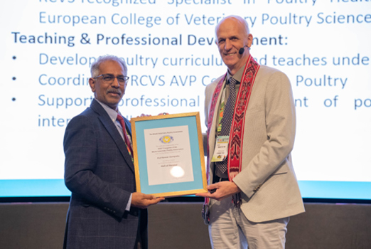 A photo of Professor Kannan Ganapathy receiving his Hall of Honour award