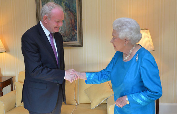 Martin McGuinness shaking hands with the Queen