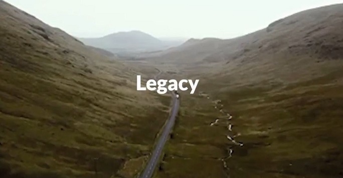 'legacy' in bold white text over a scenic rural background