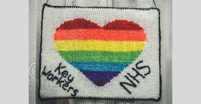 hand embroidered multi coloured hear with NHS and key workers at the side 
