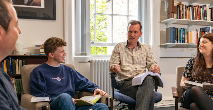 Image of Professor Frank Shovlin and students reading