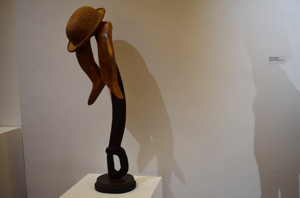 Wooden sculpture of bowler hat