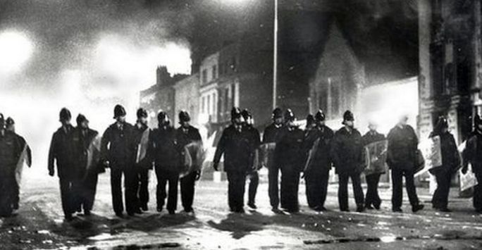 A police line advances during the Liverpool 8 Uprising, July 1981