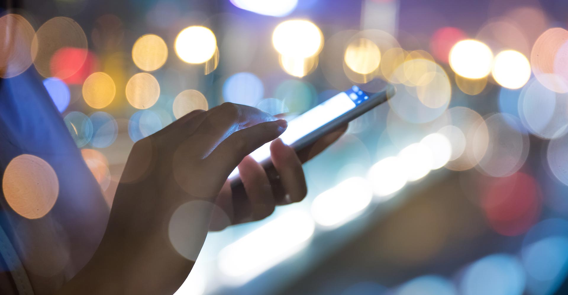 Hands folding a mobile phone