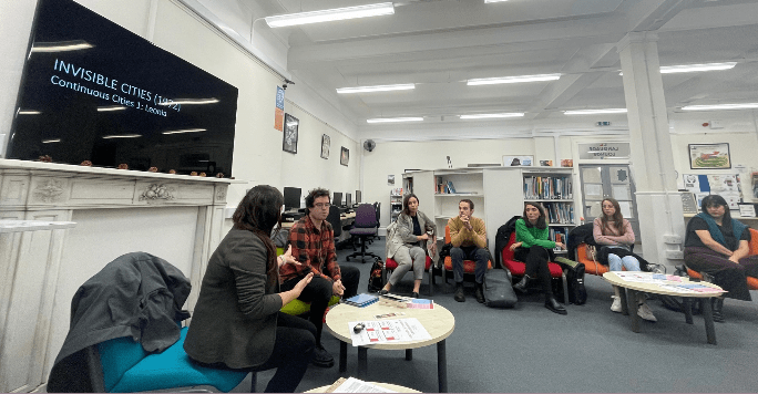 A group of people sit in the language lounge during an Italian Week event