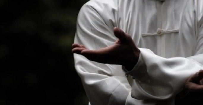 black and white image of someone performing tai chi