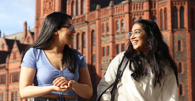 Two girls laughing.