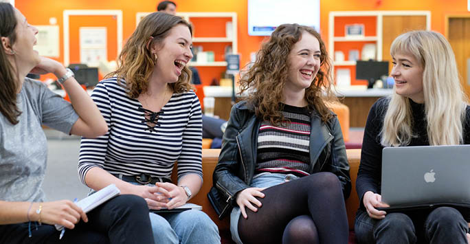 A group of students laughing.