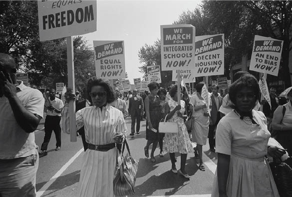 Black and white photo of a march calling for equality for black people.