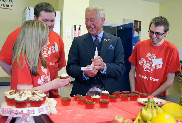 A photo of King Charles with members of the Prince's Trust.