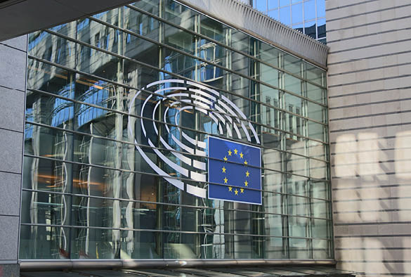 A photo of the European Parliament with the European Union flag.
