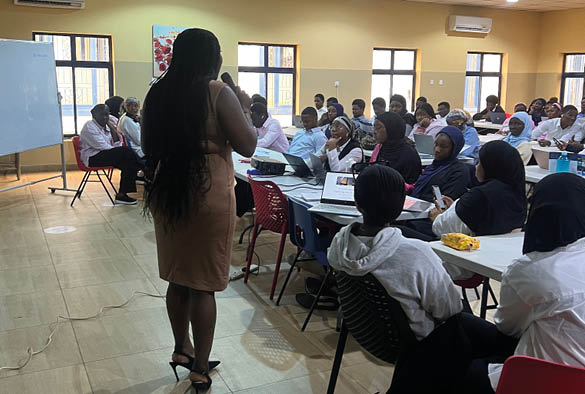 Fola giving a lecture in a Nigerian school.