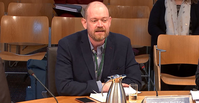 Dr John Piction as witness in Scottish Parliament