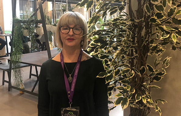 Karen in the foyer of the School of Law and Social Justice