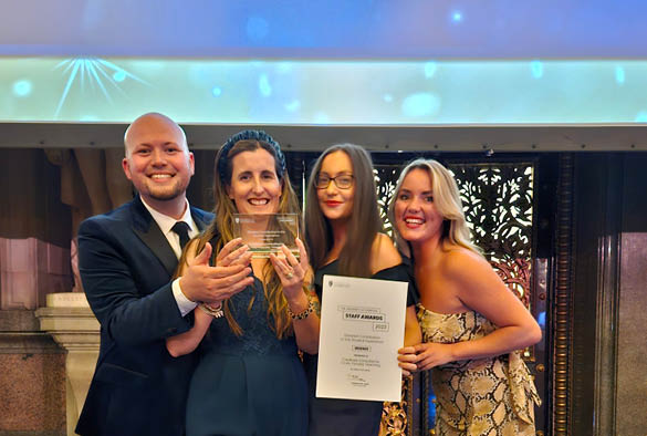 A group on academics receiving their award at the University's staff awards 2023.