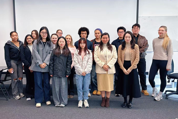 The Yingke delegation stand with a large group of law students.