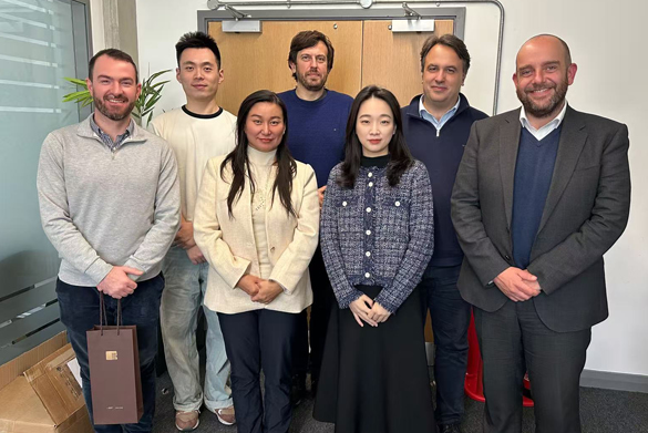 The Yingke delegation standing with staff from the School of Law and Social Justice.