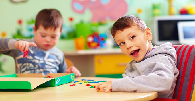 Autistic Children playing with learning adapted toys